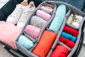 neatly folded clothes in a suitcase